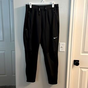 Nike men’s large joggers black.  Has zipper at the bottom